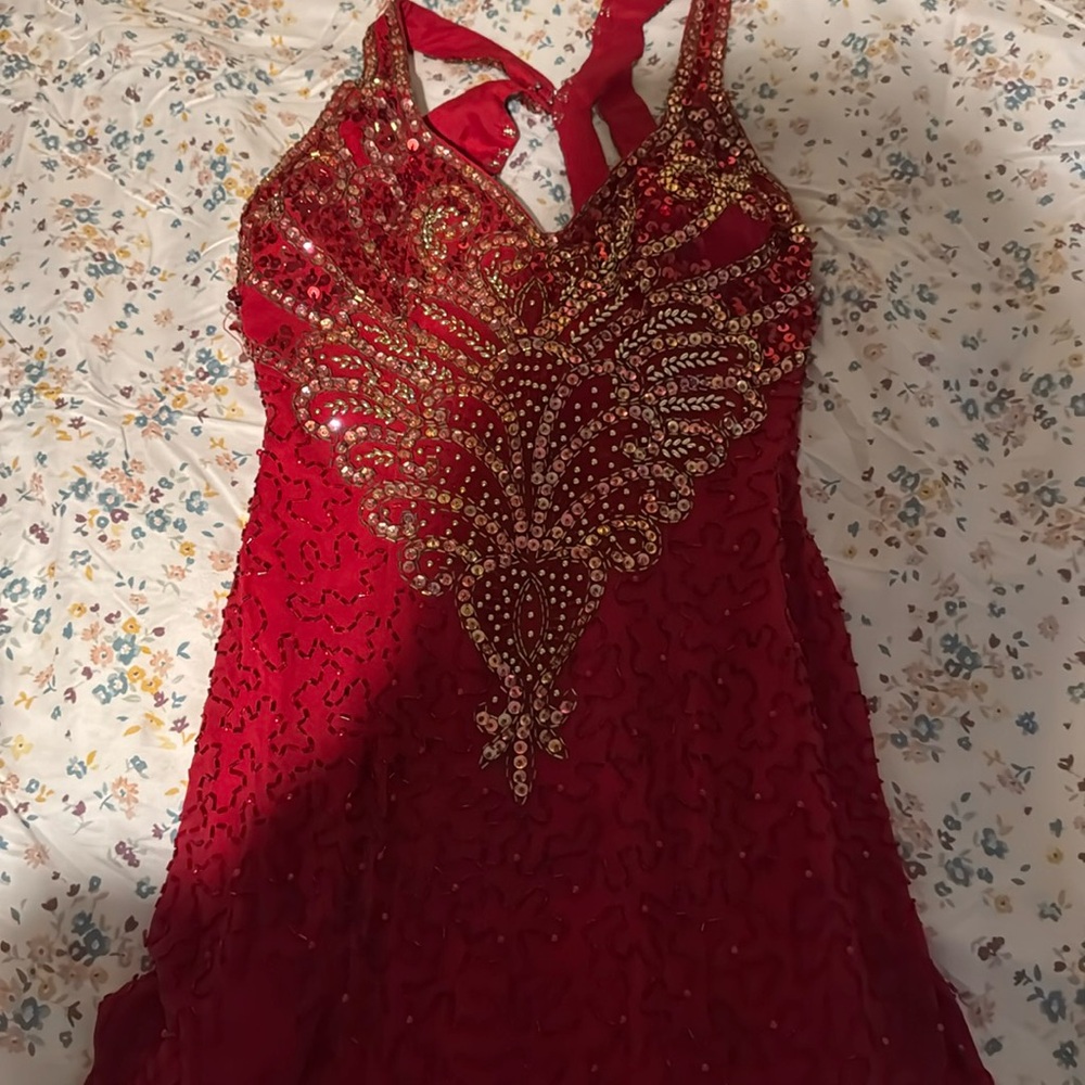 It doesn’t fit me anymore, I only had it on once, has a tiny rip.